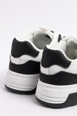 Tenis casuales unicolores con suelas planas y contrastes