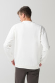 Buzo crema claro cuello redondo con arte de Looney Tunes