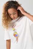 Camiseta crema cuello redondo con arte de Looney Tunes