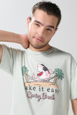 Camiseta unicolor cuello redondo con estampado de playa