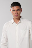 Camisa unicolor en algodón manga larga con bolsillo