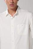 Camisa unicolor en algodón manga larga con bolsillo