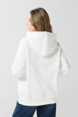 Buzo crema oversize con capota y diseño de playa