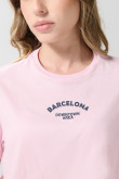Camiseta unicolor crop top con diseño college delantero