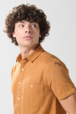 Camisa en algodón unicolor manga corta con cuello sport