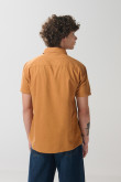 Camisa en algodón unicolor manga corta con cuello sport
