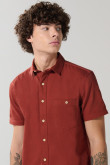 Camisa en algodón unicolor manga corta con cuello sport