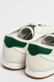 Tenis tipo casuales unicolores con contrastes laterales