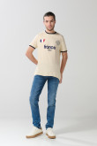 Jean skinny azul con tiro bajo, desgastes y ajuste ceñido