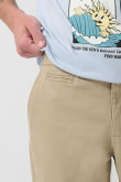 Pantalón slim unicolor en dril con bolsillos y tiro medio