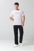Camiseta en algodón manga corta unicolor con texto en frente