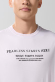 Camiseta en algodón manga corta unicolor con texto en frente