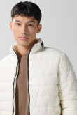 Chaqueta acolchada cuello alto unicolor con cremallera