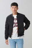 Chaqueta unicolor bomber con bolsillos y acabados en rib