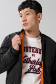 Chaqueta unicolor bomber con bolsillos y acabados en rib