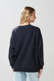 Buzo cuello redondo oversize unicolor con manga larga