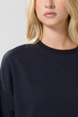 Buzo cuello redondo oversize unicolor con manga larga