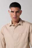 Camisa en algodón unicolor cuello sport collar con bolsillo