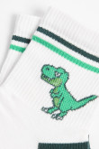 Medias cortas cremas claras con diseño de dinosaurio
