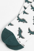 Medias tobilleras cremas con diseños de dinosaurios