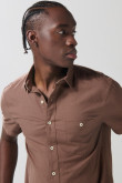 Camisa unicolor en algodón con botones y manga corta