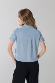 Blusa unicolor en algodón manga corta con bolsillo