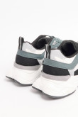 Tenis verdes oscuros de plataforma con cortes en contraste