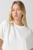 Camiseta unicolor crop top con texto minimalista