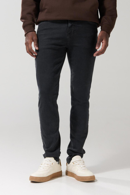 Jean slim gris oscuro tiro bajo con ligeros desgastes
