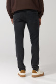 Jean slim gris oscuro tiro bajo con ligeros desgastes