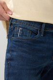 Jean skinny azul con ajuste ceñido, cremallera y tiro bajo