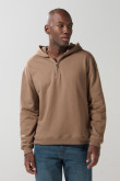 Buzo oversize unicolor con capota y cremallera