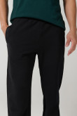Pantalón jogger unicolor con elástico en bota y bolsillos
