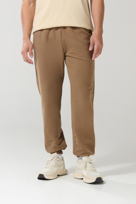 Pantalón jogger unicolor con elástico en bota y bolsillos