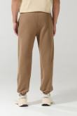 Pantalón jogger unicolor con elástico en bota y bolsillos