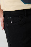 Jean skinny ajustado negro con cremallera y tiro bajo