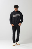 Buzo cuello redondo unicolor oversize con arte college
