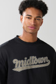 Buzo cuello redondo unicolor oversize con arte college