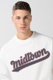 Buzo cuello redondo unicolor oversize con arte college