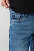 Jean skinny azul oscuro con cremallera y tiro bajo