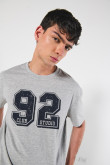 Camiseta unicolor college oversize con manga corta