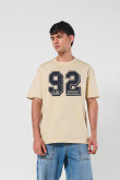 Camiseta unicolor college oversize con manga corta