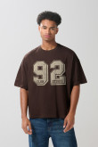 Camiseta unicolor college oversize con manga corta