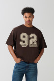 Camiseta unicolor college oversize con manga corta