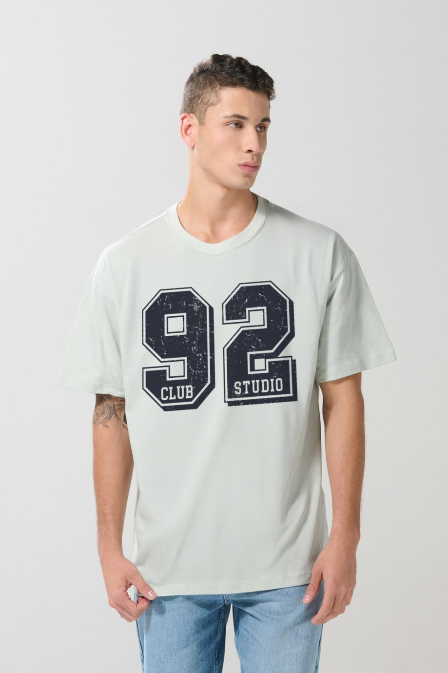 Camiseta unicolor college oversize con manga corta