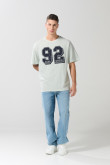 Camiseta unicolor college oversize con manga corta
