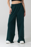 Pantalón jogger unicolor con bolsillos y bota ancha