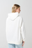 Buzo unicolor oversize college con capota y bolsillo