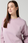 Buzo rosado claro oversize con cuello redondo