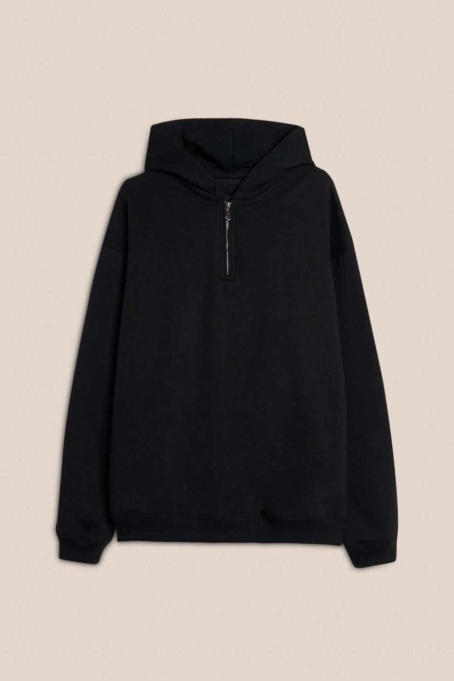 Buzo oversize unicolor con capota y cremallera